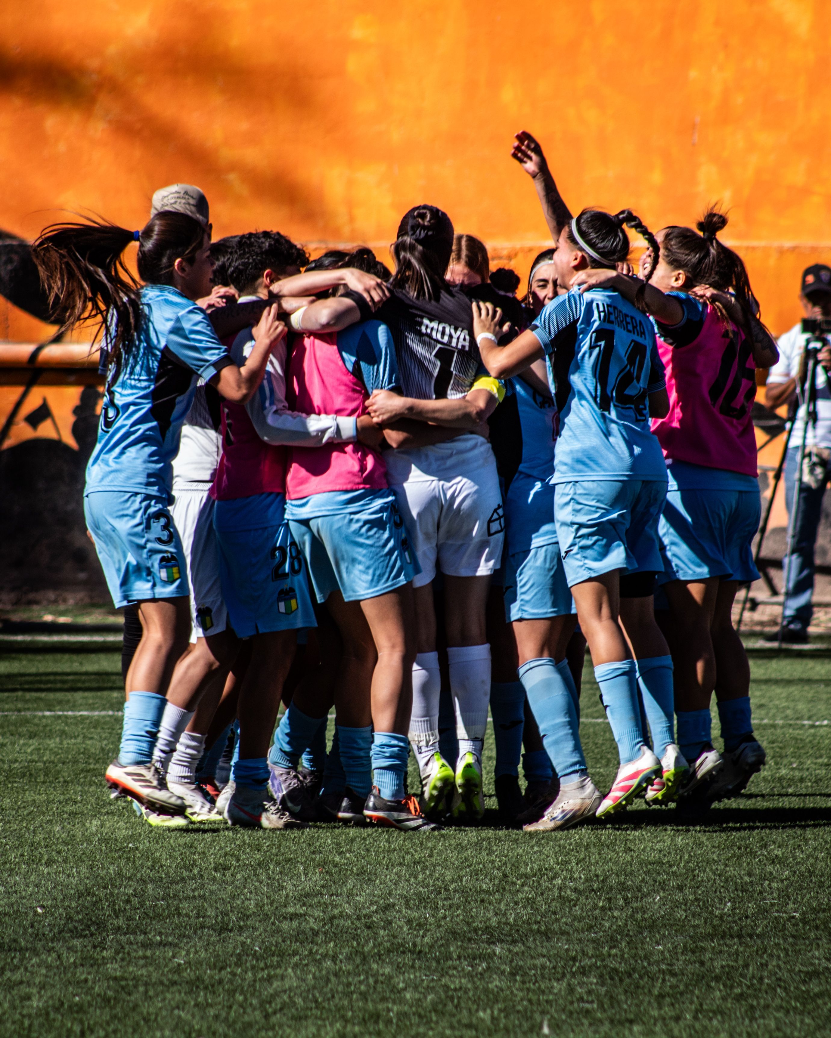 Young soccer players celebrating together